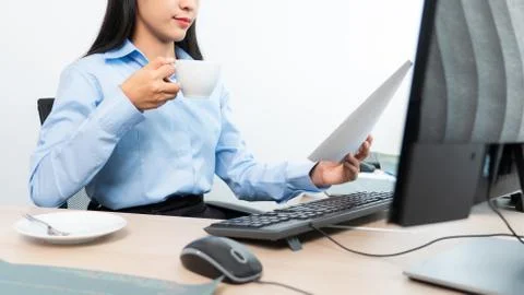 Asian woman Programming working with computer and typing data code to develop 库存照片