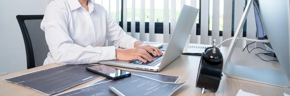 Asian woman Programming working with computer and typing data code to develop Stock Photos