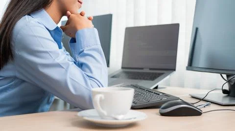 Asian woman Programming working with computer and typing data code to develop Stock Photos