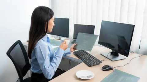 Asian woman Programming working with computer and typing data code to develop 스톡 사진