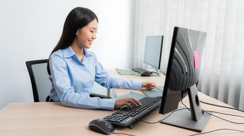Asian woman Programming working with computer and typing data code to develop 스톡 사진