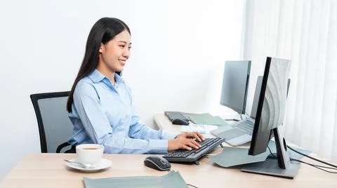 Asian woman Programming working with computer and typing data code to develop Foto stock