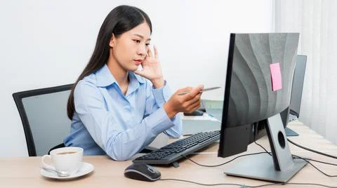 Asian woman Programming working with computer and typing data code to develop Stockfoto's