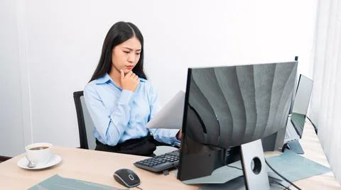 Asian woman Programming working with computer and typing data code to develop Stock Photos