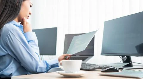 Asian woman Programming working with computer and typing data code to develop Foto stock