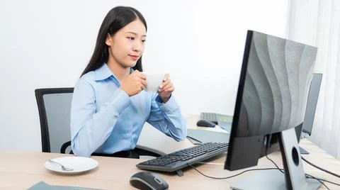 Asian woman Programming working with computer and typing data code to develop 写真素材
