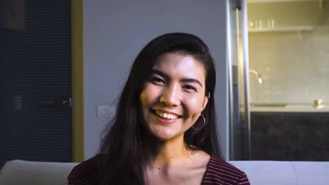 The Asian woman smiles for the camera. Stock Footage 171922853