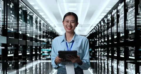 Asian Woman Smiling To Camera While Working With Digital Tablet In Server Room Stock Footage 248004998