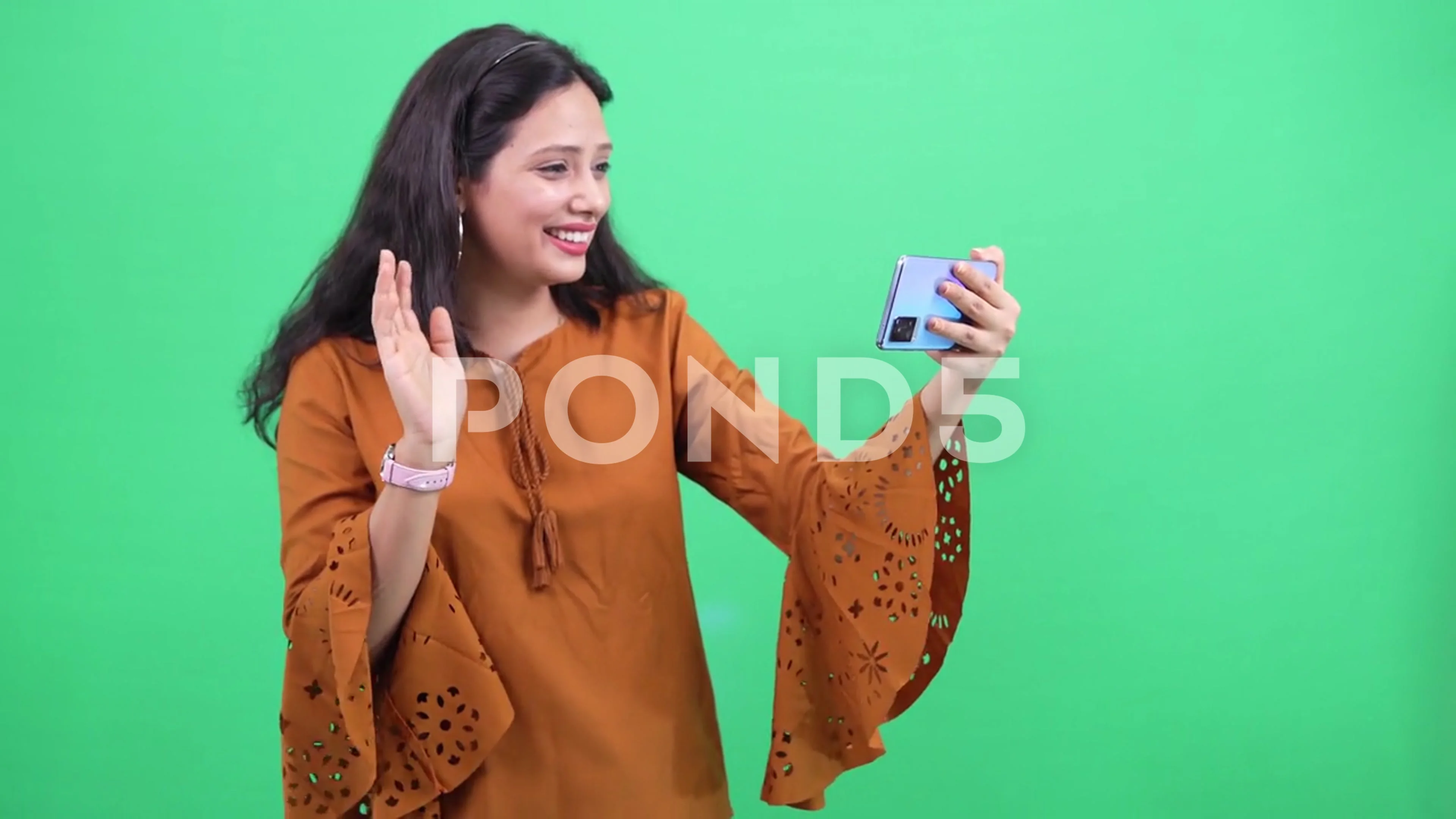 Asian woman talking on video call on a smart phone mobile. waving hands.