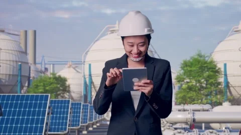 Asian Woman Use Tablet While Walking at Energy Complex Stock Footage 330173552