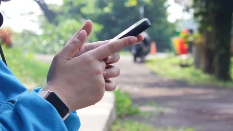Asian woman using and texting on her smartphone Stock Footage 337089678