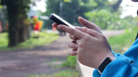 Asian woman using and texting on her smartphone Stock Footage 337089684