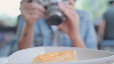 Asian woman using camera while sitting on table in cafe. Stock Footage 101548639