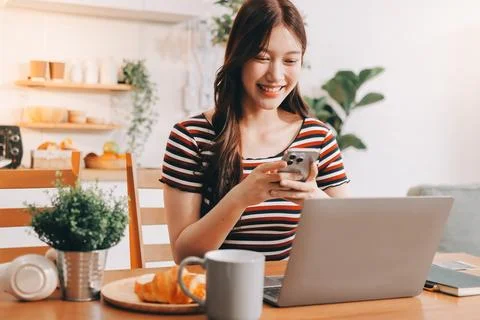 Asian woman using computer remote for business studying, watching online vi.. Fotos Stock