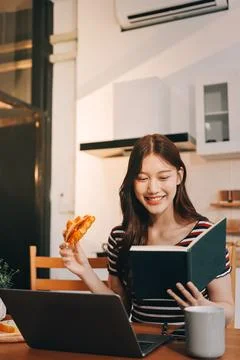 Asian woman using computer remote for business studying, watching online vi.. Фото