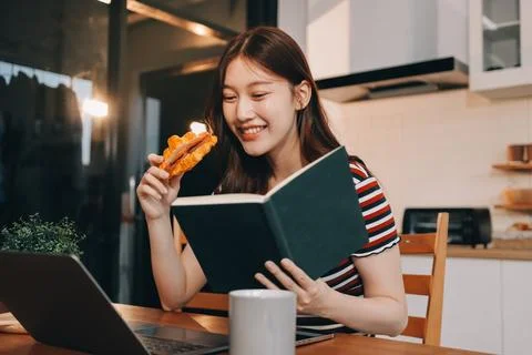 Asian woman using computer remote for business studying, watching online vi.. Fotos Stock