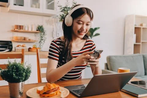 Asian woman using computer remote for business studying, watching online vi.. Фото
