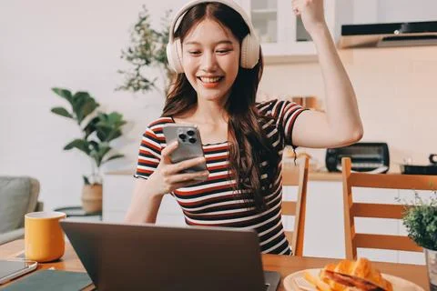 Asian woman using computer remote for business studying, watching online vi.. Fotos Stock