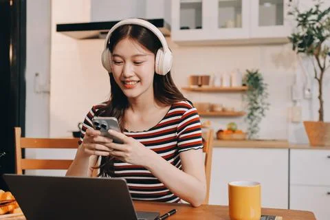 Asian woman using computer remote for business studying, watching online vi.. Fotos Stock