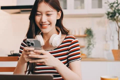 Asian woman using computer remote for business studying, watching online vi.. Фото
