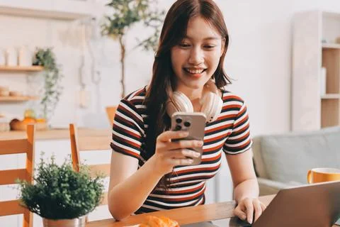 Asian woman using computer remote for business studying, watching online vi.. Fotos Stock