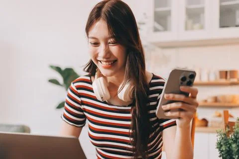 Asian woman using computer remote for business studying, watching online vi.. Фото