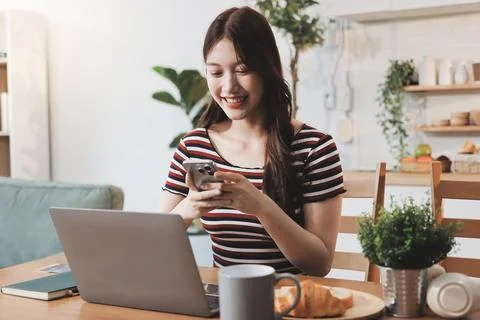 Asian woman using computer remote for business studying, watching online vi.. Фото