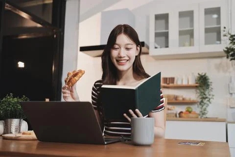 Asian woman using computer remote for business studying, watching online vi.. Фото