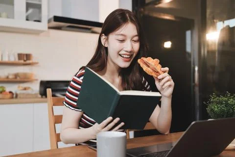 Asian woman using computer remote for business studying, watching online vi.. Фото