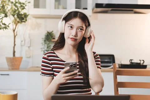 Asian woman using computer remote for business studying, watching online vi.. Фото