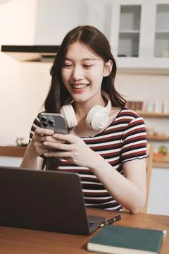 Asian woman using computer remote for business studying, watching online vi.. Фото