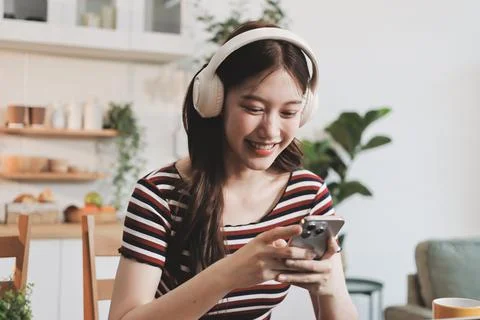 Asian woman using computer remote for business studying, watching online vi.. Фото