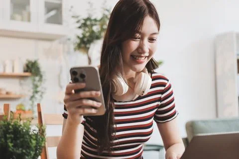 Asian woman using computer remote for business studying, watching online vi.. Фото