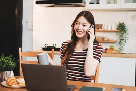 Asian woman using computer remote for business studying, watching online vi.. Фото