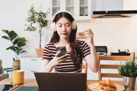 Asian woman using computer remote for business studying, watching online vi.. Фото