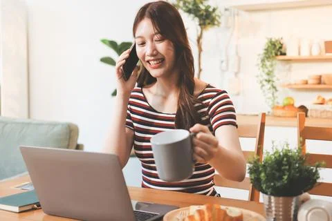 Asian woman using computer remote for business studying, watching online vi.. Stock Photos