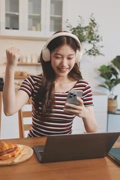 Asian woman using computer remote for business studying, watching online vi.. Stock Photos