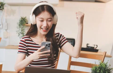 Asian woman using computer remote for business studying, watching online vi.. Stock Photos