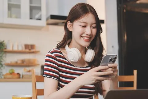 Asian woman using computer remote for business studying, watching online vi.. Stock Photos
