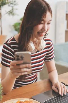 Asian woman using computer remote for business studying, watching online vi.. Stock Photos