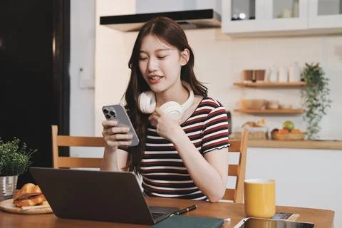Asian woman using computer remote for business studying, watching online vi.. Stock Photos
