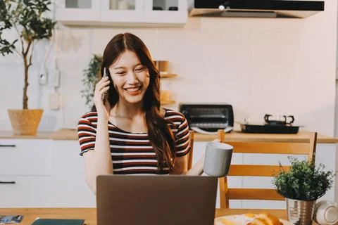 Asian woman using computer remote for business studying, watching online vi.. Stock Photos