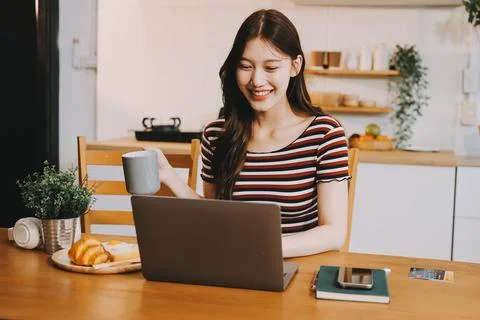 Asian woman using computer remote for business studying, watching online vi.. Stock Photos
