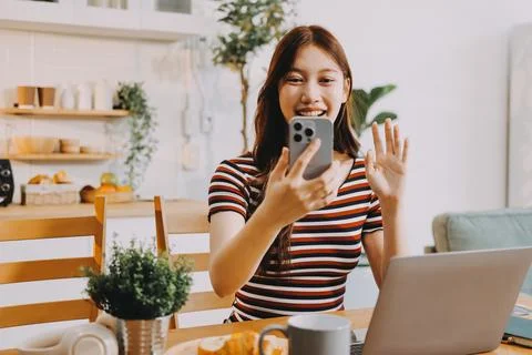 Asian woman using computer remote for business studying, watching online vi.. Stock Photos