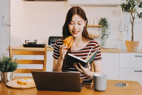 Asian woman using computer remote for business studying, watching online vi.. Stock Photos