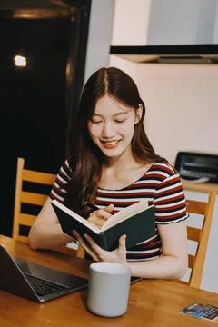 Asian woman using computer remote for business studying, watching online vi.. Stock Photos