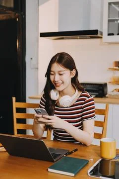 Asian woman using computer remote for business studying, watching online vi.. Stock Photos