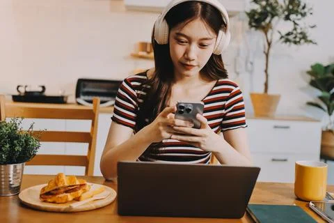 Asian woman using computer remote for business studying, watching online vi.. Stock Photos