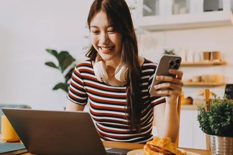 Asian woman using computer remote for business studying, watching online vi.. Stock Photos