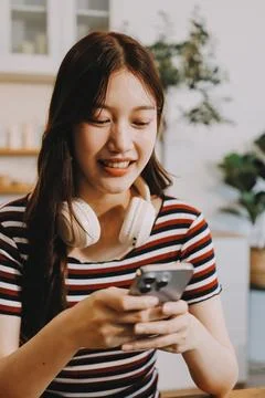 Asian woman using computer remote for business studying, watching online vi.. Stock Photos